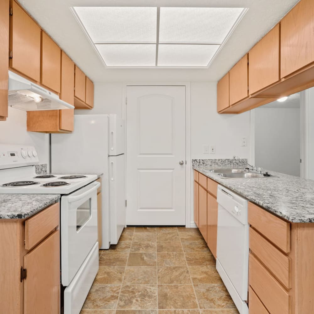 White kitchen appliances in an apartment kitchen at Stonebridge Apartments in West Jordan, Utah