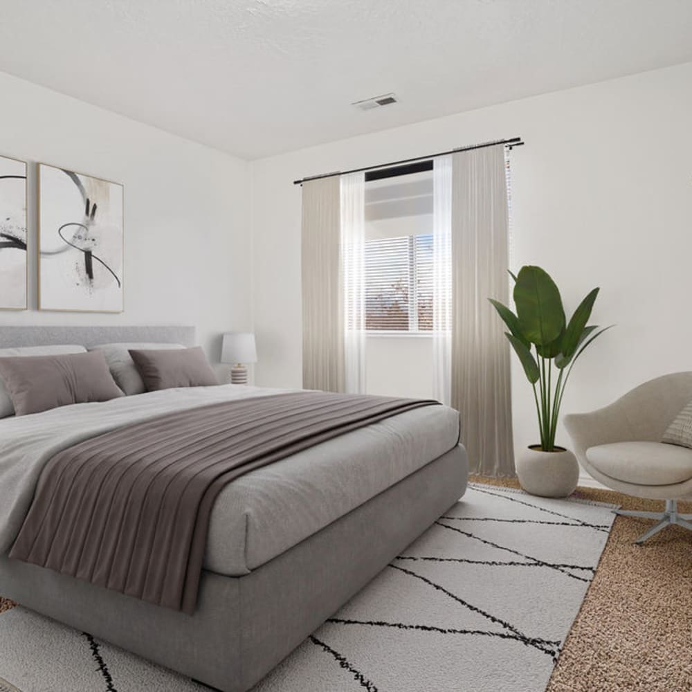 A furnished apartment bedroom at Stonebridge Apartments in West Jordan, Utah