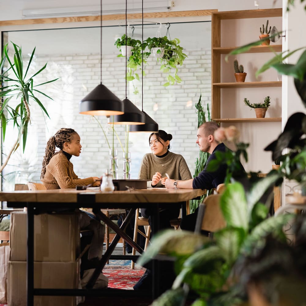 Residents meeting in a plant shop near The Village at SoTa in Tacoma, Washington