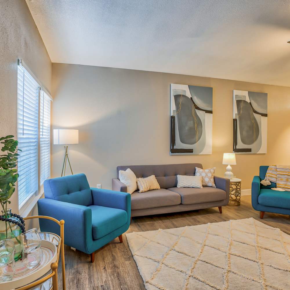 Modern living room with furniture at Ascent Townhome Apartments in Fresno, California