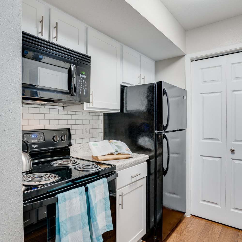 Kitchen with black appliances at Ridgemont at Stringers Ridge in Chattanooga, Tennessee