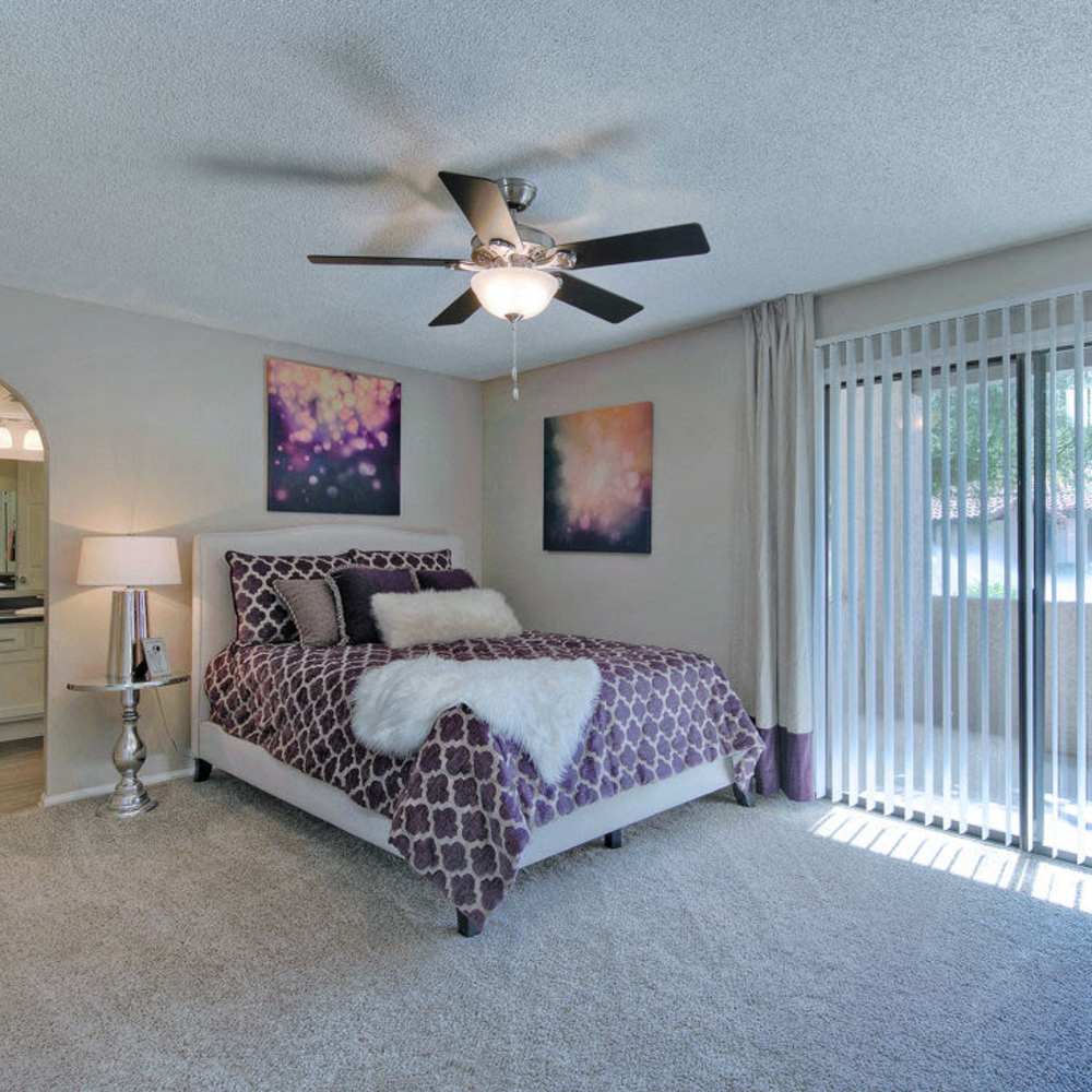 Bedroom with access to the balcony at Fountain Palms in Peoria, Arizona