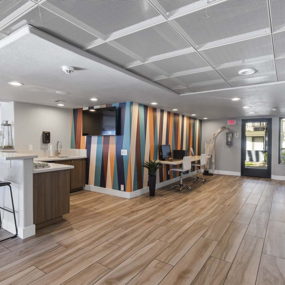 Clubhouse with wood-style flooring at Fountain Palms in Peoria, Arizona