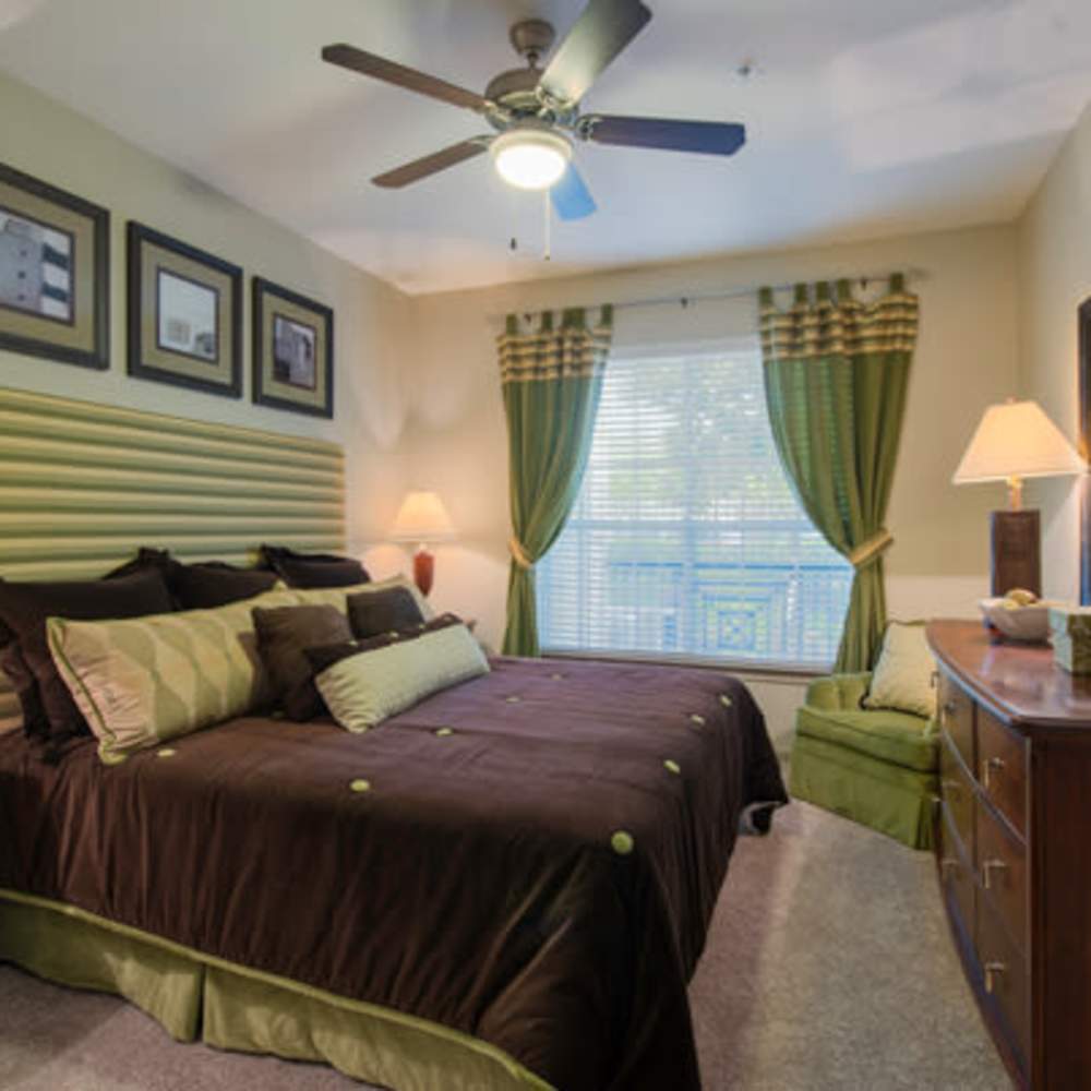 Bedroom with plush carpeting at Woodland Park in Houston, Texas
