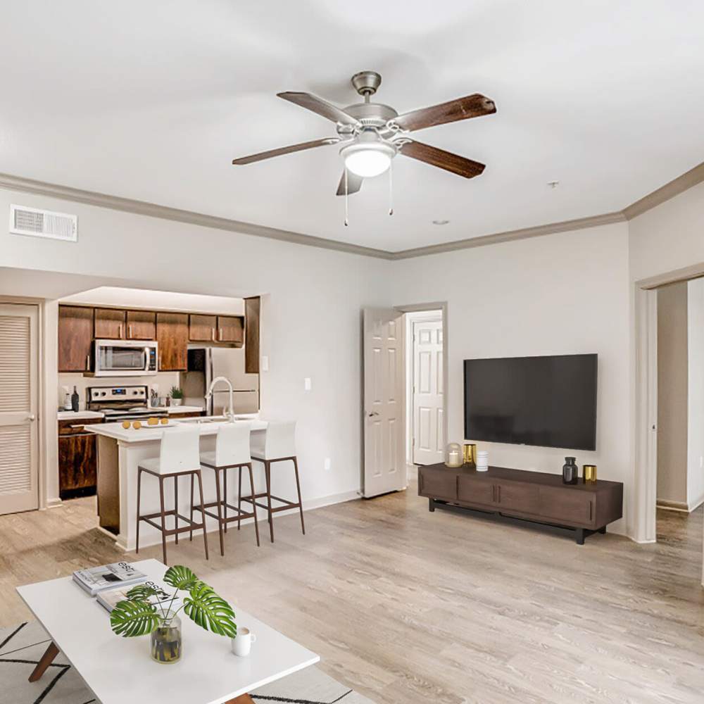 Living space with a ceiling fan at Woodland Park in Houston, Texas
