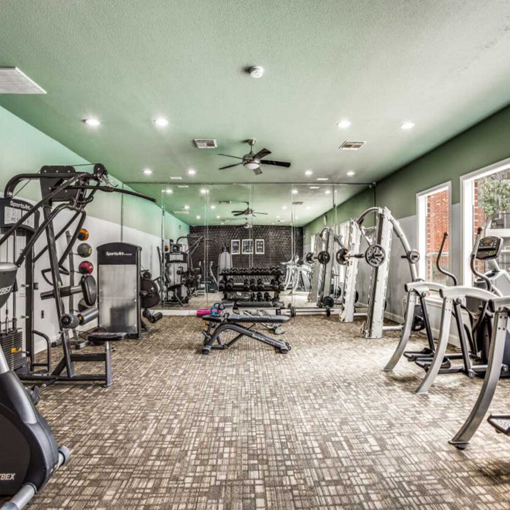 Fitness center with free-weights at Woodland Park in Houston, Texas