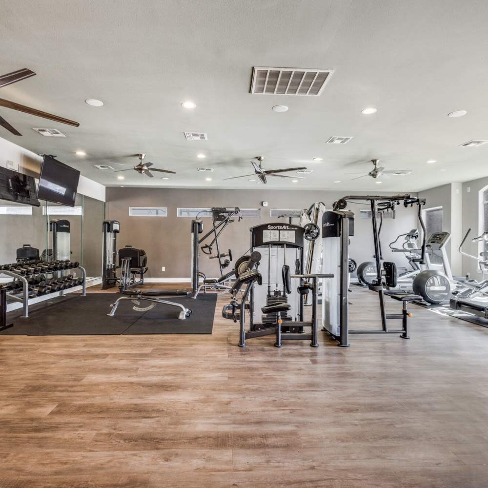 Fitness center with exercise machines at Oak Crest in Houston, Texas