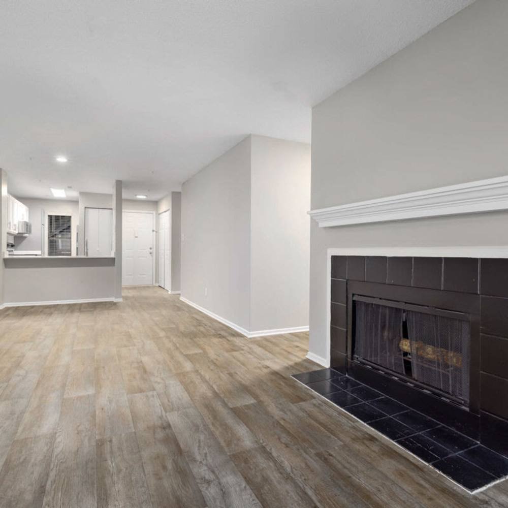 Living space with a fireplace at Concord Apartments in Raleigh, North Carolina