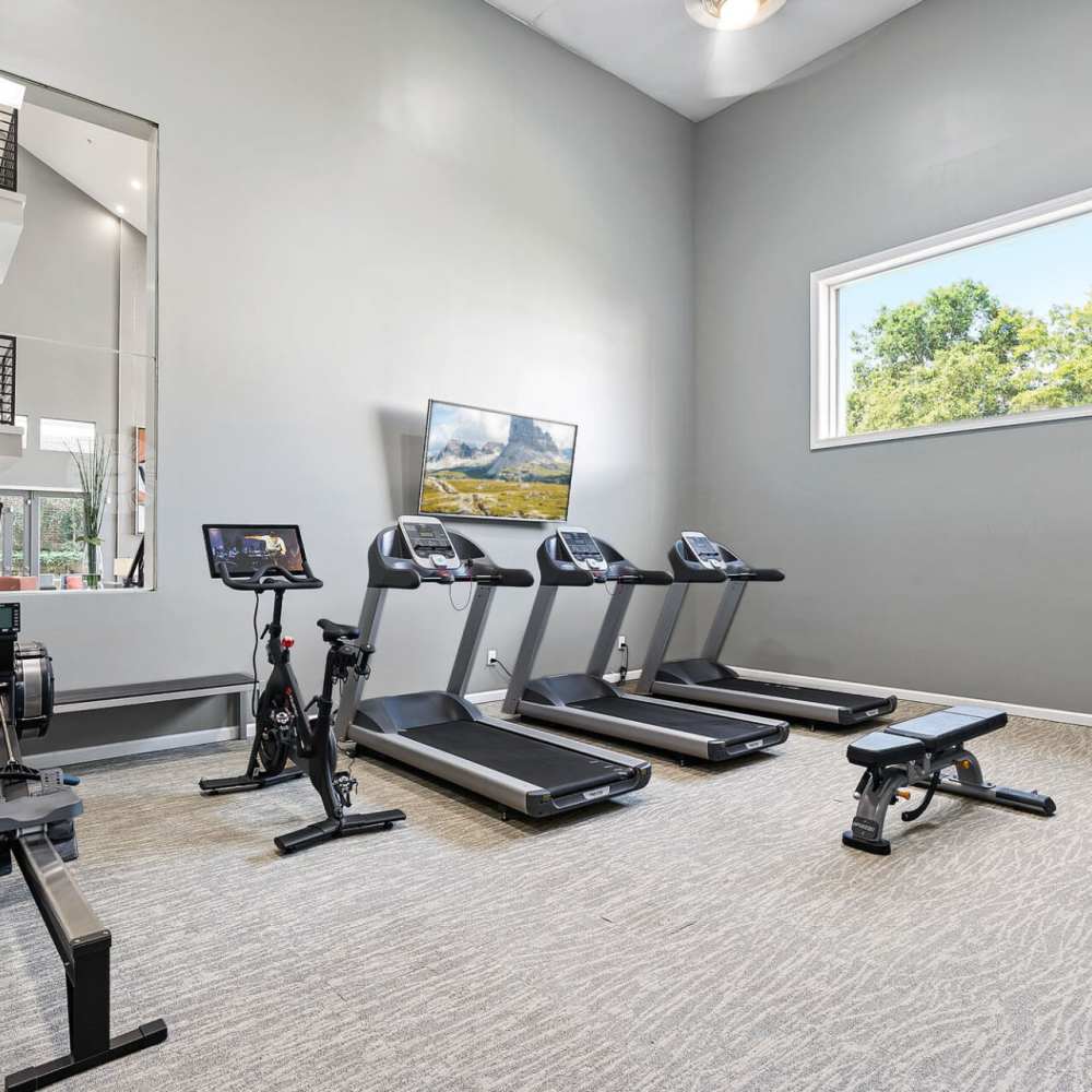 Fitness center with treadmills at Concord Apartments in Raleigh, North Carolina