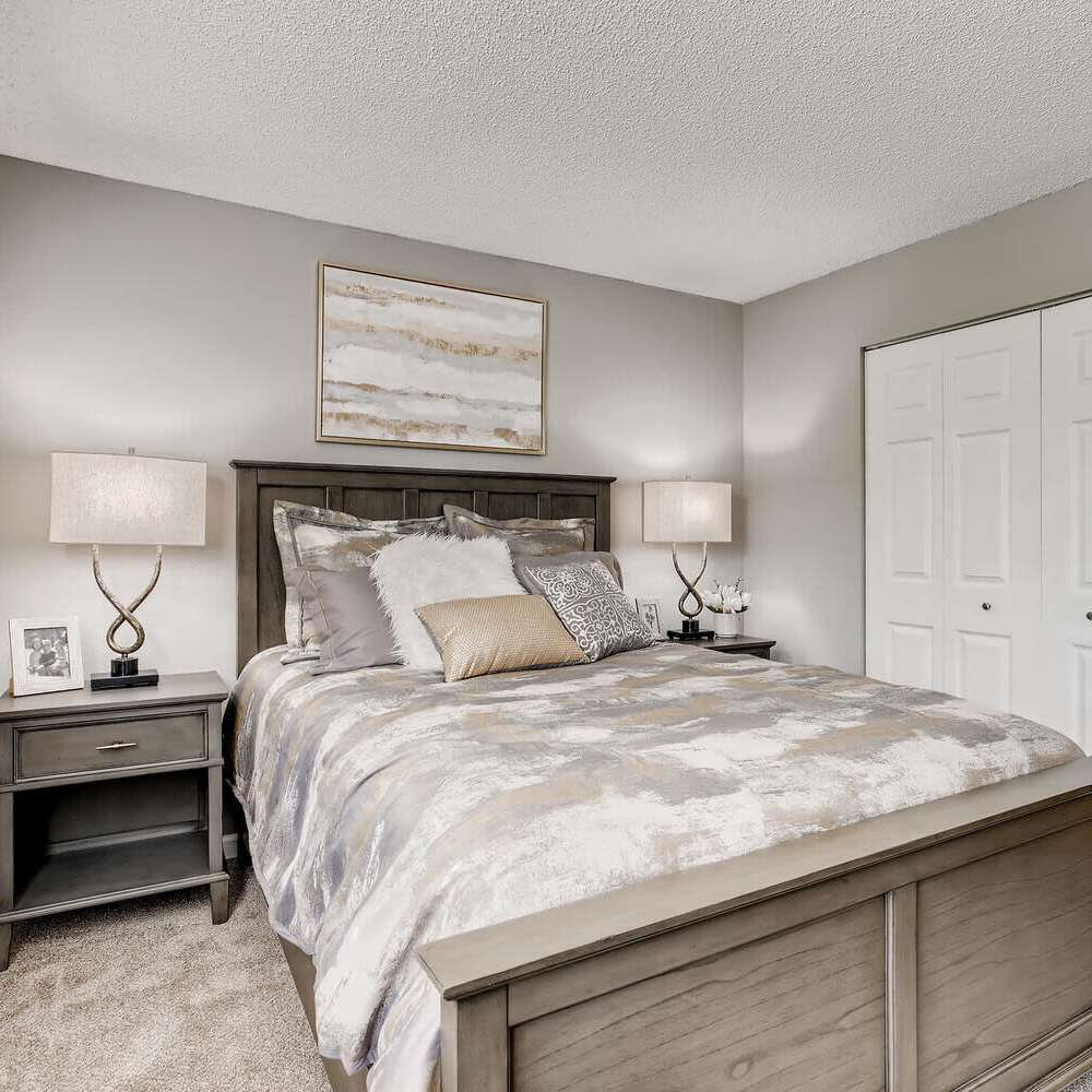 Bedroom with plush carpeting at Loretto Heights in Denver, Colorado