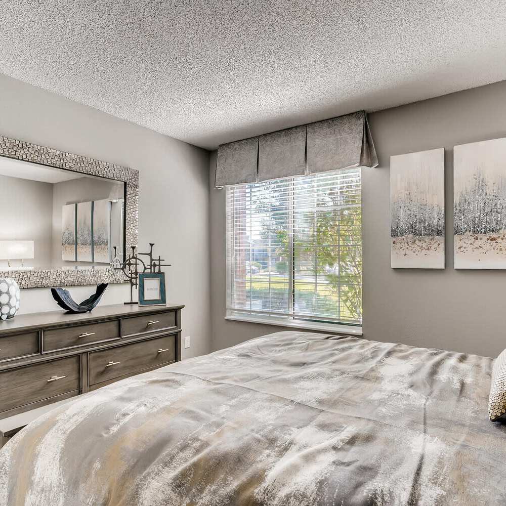 Bedroom with large windows at Loretto Heights in Denver, Colorado