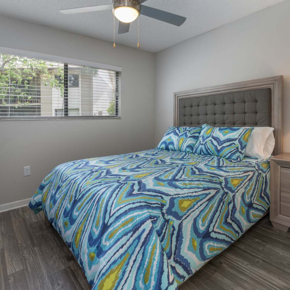 Bedroom with wood-style flooring at Four Lakes at Clearwater in Clearwater, Florida