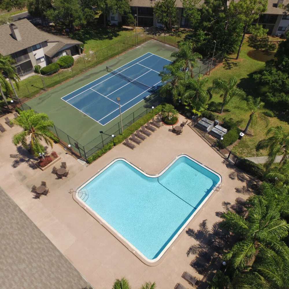 Swimming pool and sports court at Four Lakes at Clearwater in Clearwater, Florida