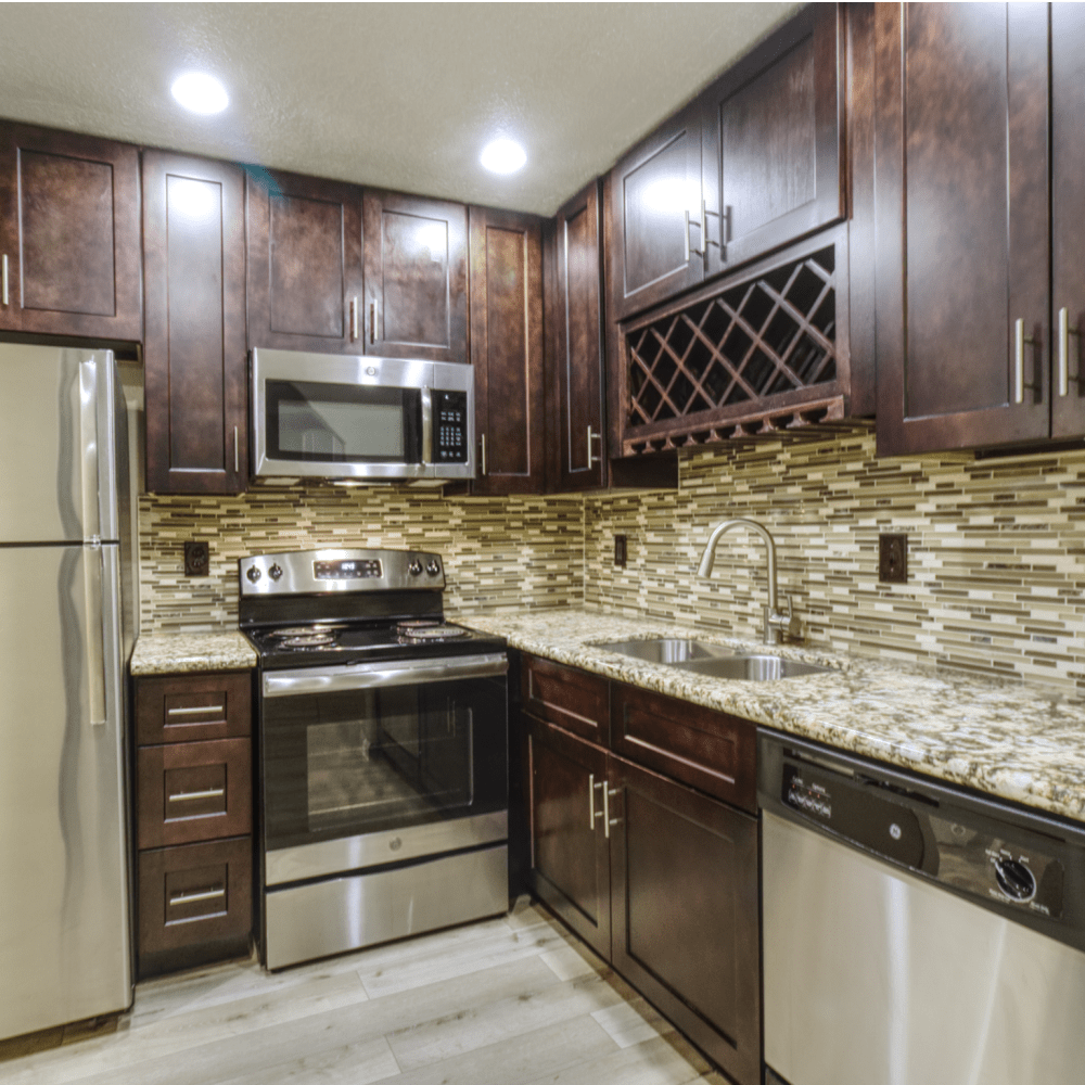 Kitchen with dark accents Walden of Westchase in Houston, Texas