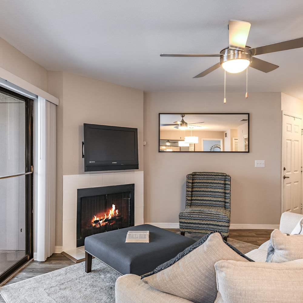 Living space with a fireplace at Fourteen01 Apartments in Orlando, Florida