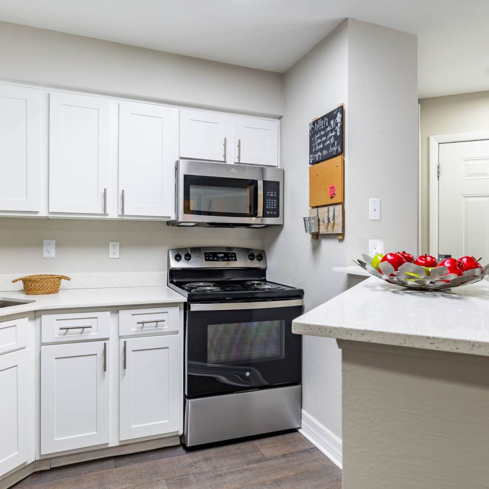 Kitchen with stainless-steel appliances at Fourteen01 Apartments in Orlando, Florida