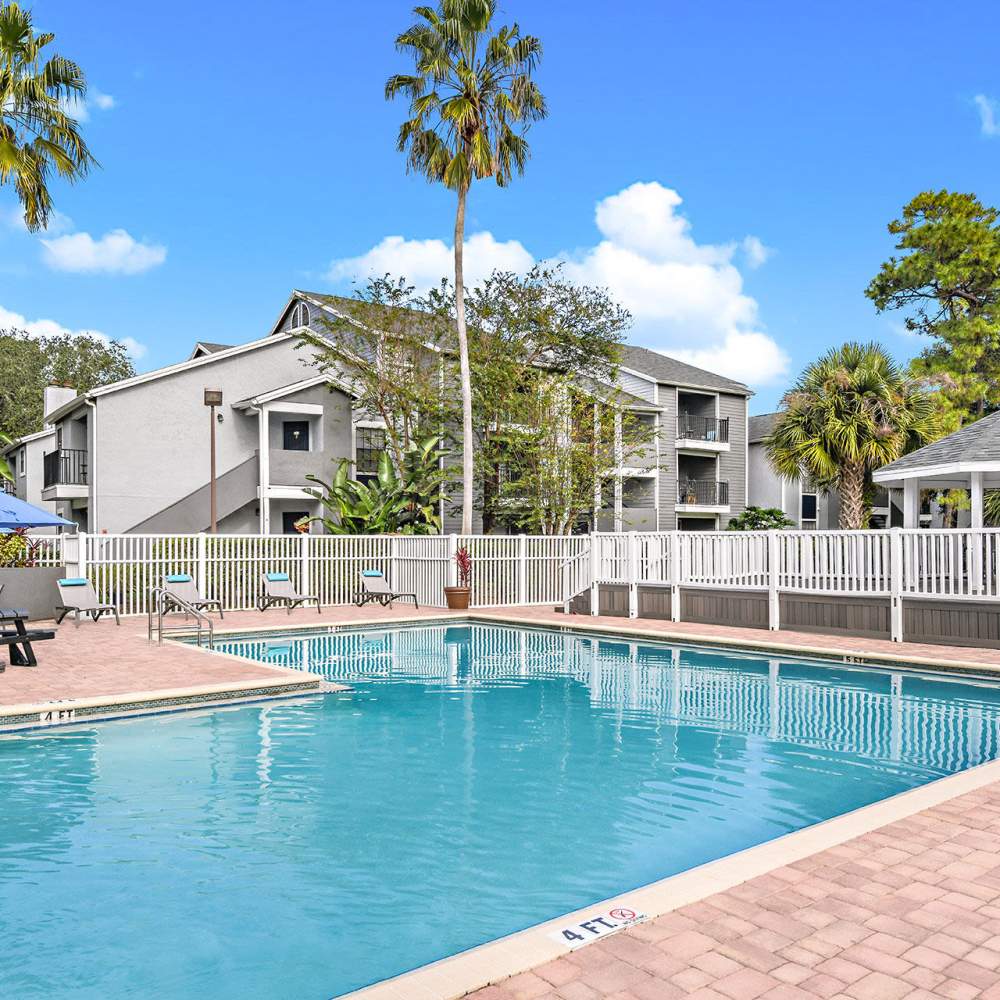 Fenced in swimming pool at Fourteen01 Apartments in Orlando, Florida
