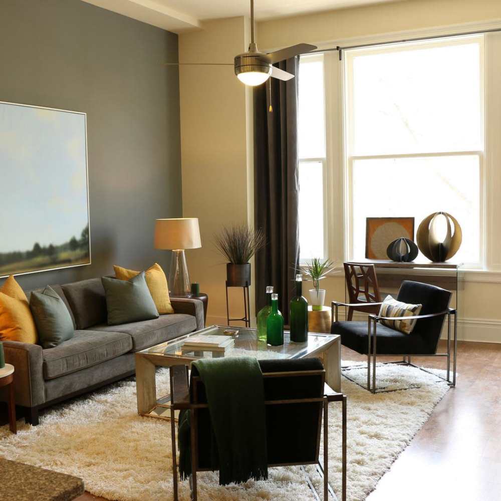 Hardwood-style flooring in the well-furnished bedroom of an apartment home at The Edison Apartments in Richmond, Virginia