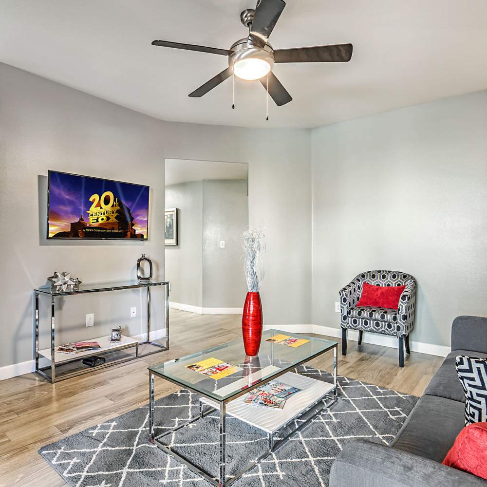 Living space with a ceiling fan at Calypso Apartments in Las Vegas, Nevada