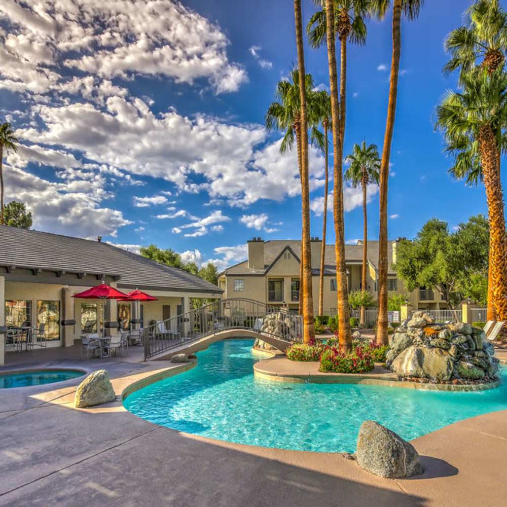 Patio tables with umbrellas around the pool at Kaleidoscope in Las Vegas, Nevada