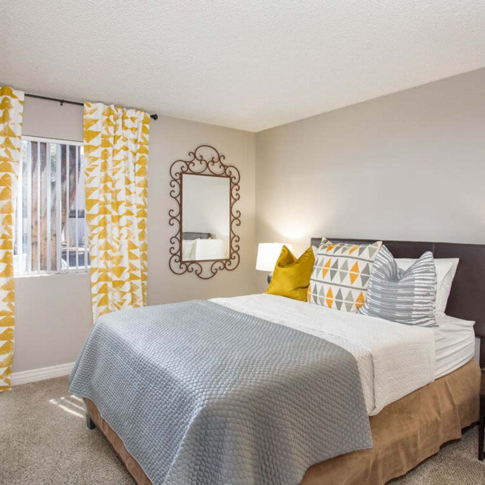 Bedroom with plush carpeting at Highland Park in Tempe, Arizona