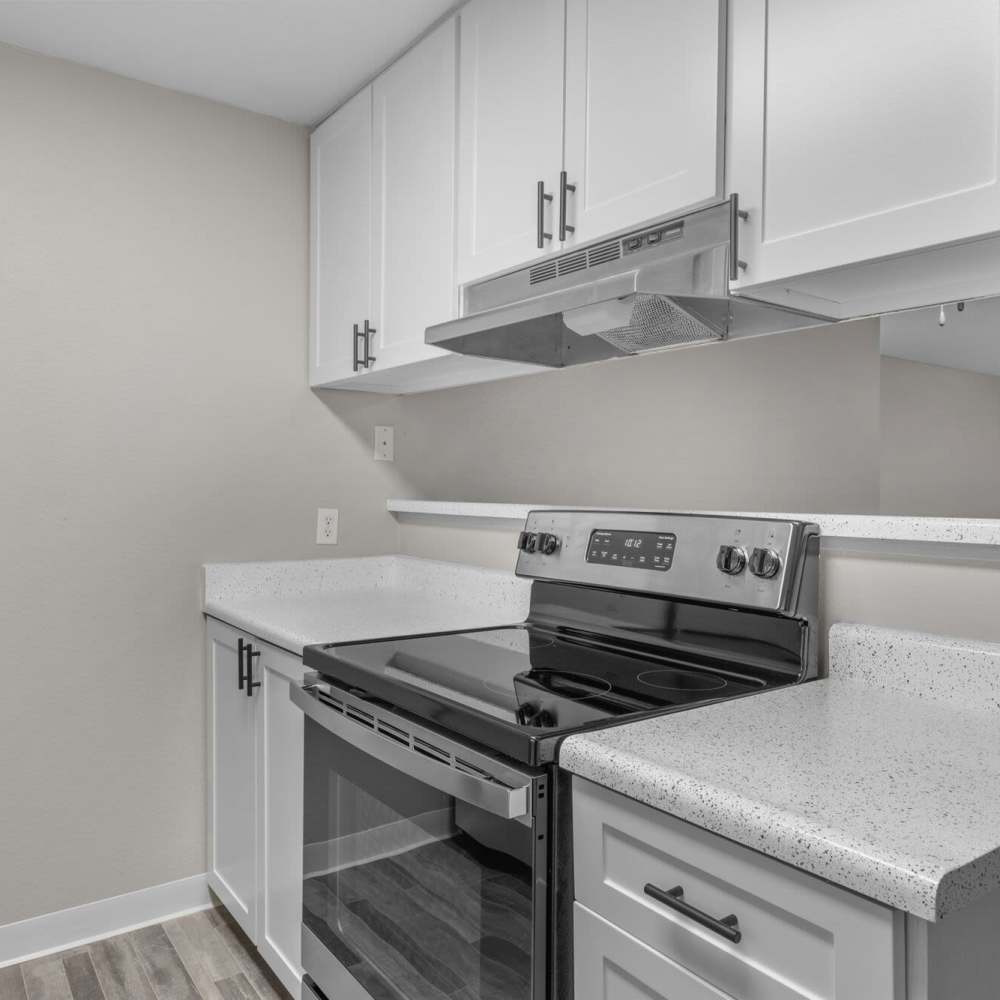 Kitchen with stainless-steel appliances at Spinnaker Apartments in Des Moines, Washington