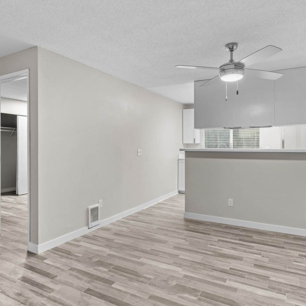 Living space with wood-style flooring at Spinnaker Apartments in Des Moines, Washington