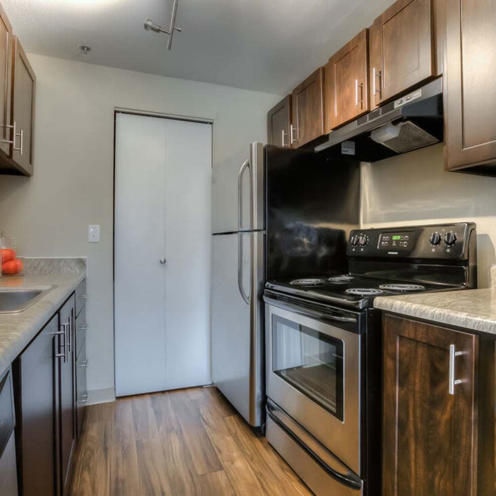 Kitchen with updated cabinetry at Spinnaker Apartments in Des Moines, Washington