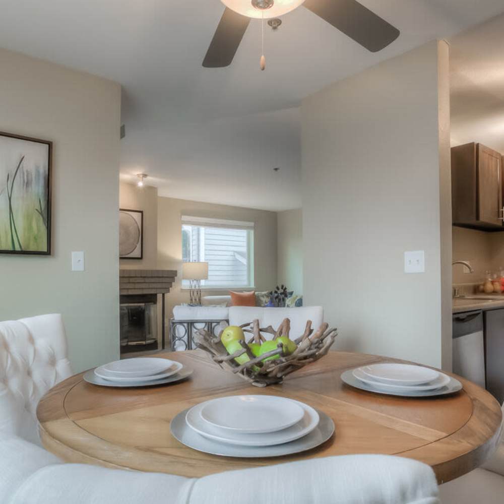 Dinning space with a ceiling fan at Spinnaker Apartments in Des Moines, Washington