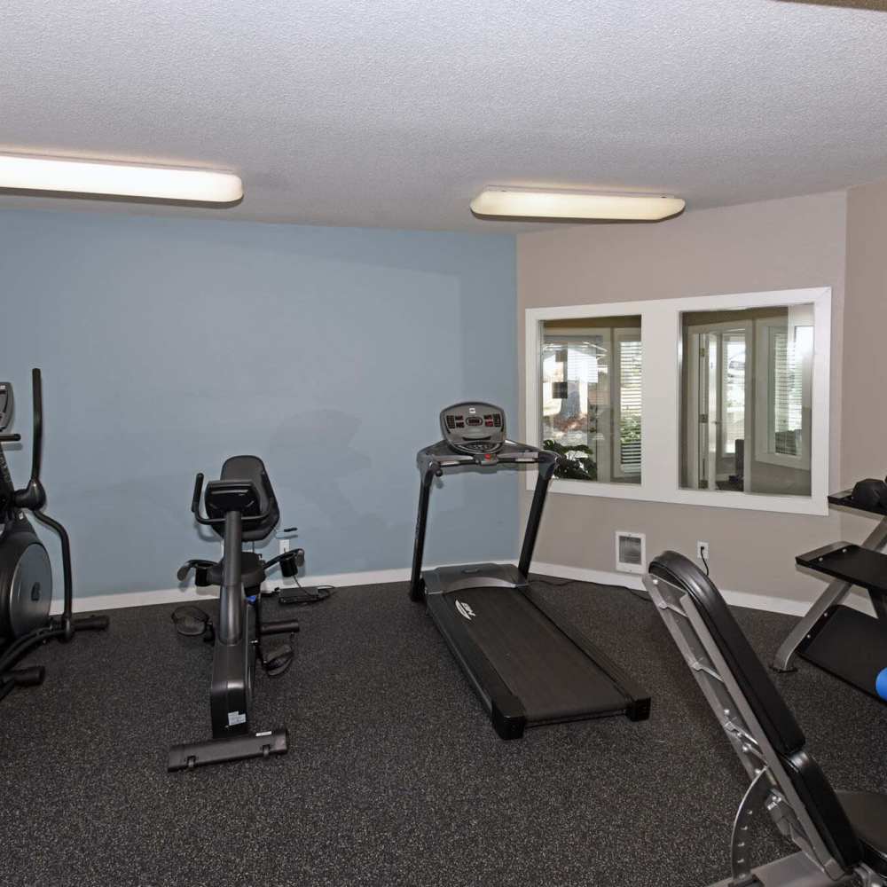 Fitness center with free-weights at Spinnaker Apartments in Des Moines, Washington