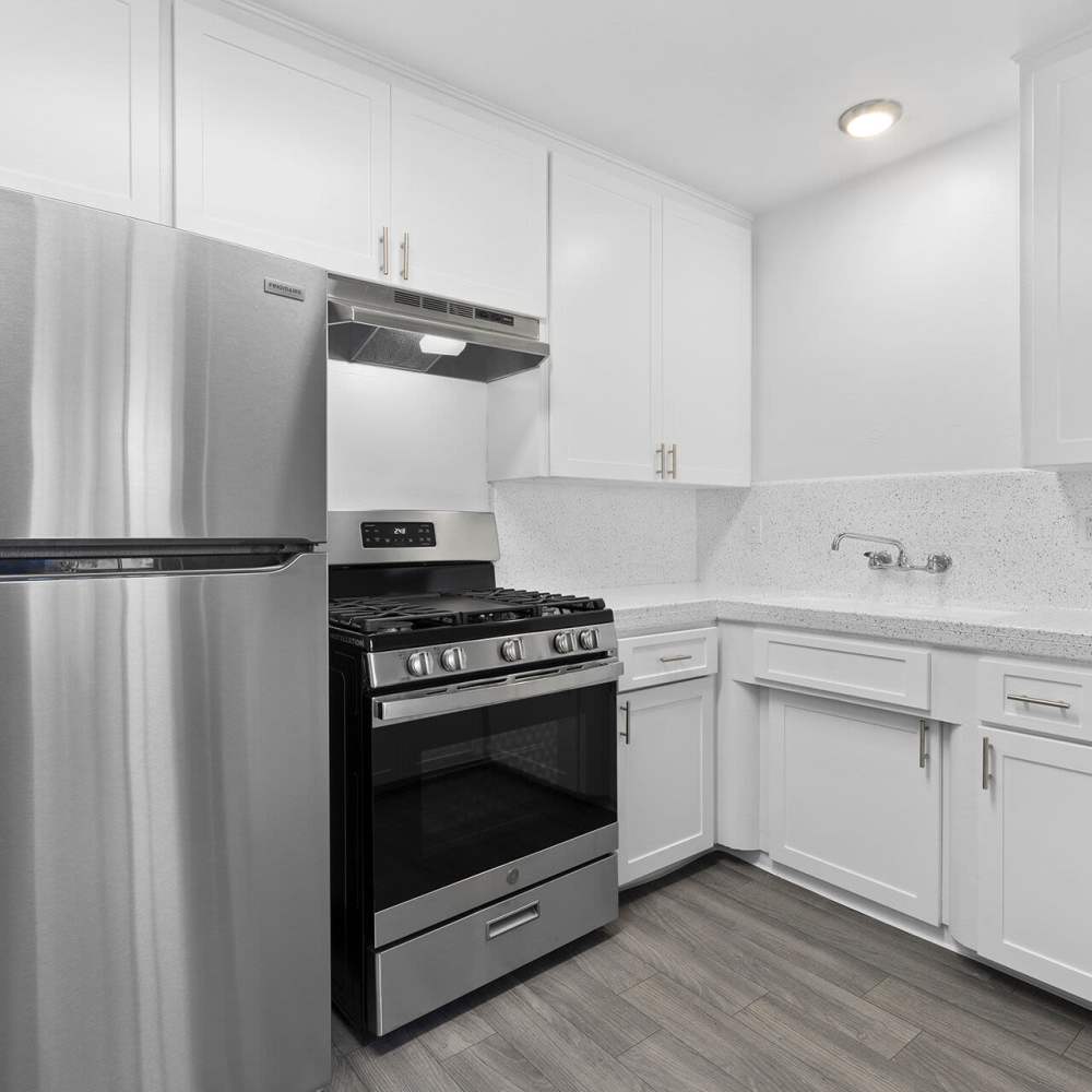 Kitchen with stainless-steel appliances at Terre at Mollison in El Cajon, California