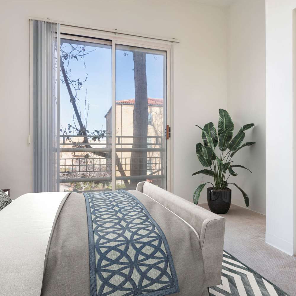 bedroom with balcony at Grand Lowry Lofts in Denver, Colorado