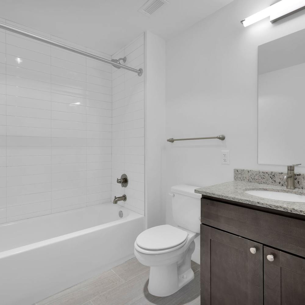 Bright bathroom with shower and tub at The Residences at Barnett in Jacksonville, Florida
