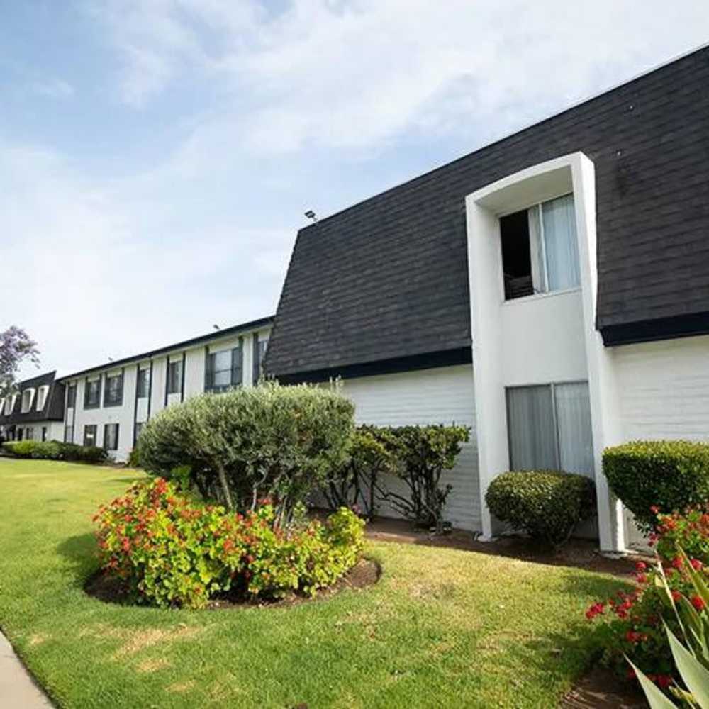 Apartment building exterior next to walkway at Terre at Sandalwood in El Cajon, California