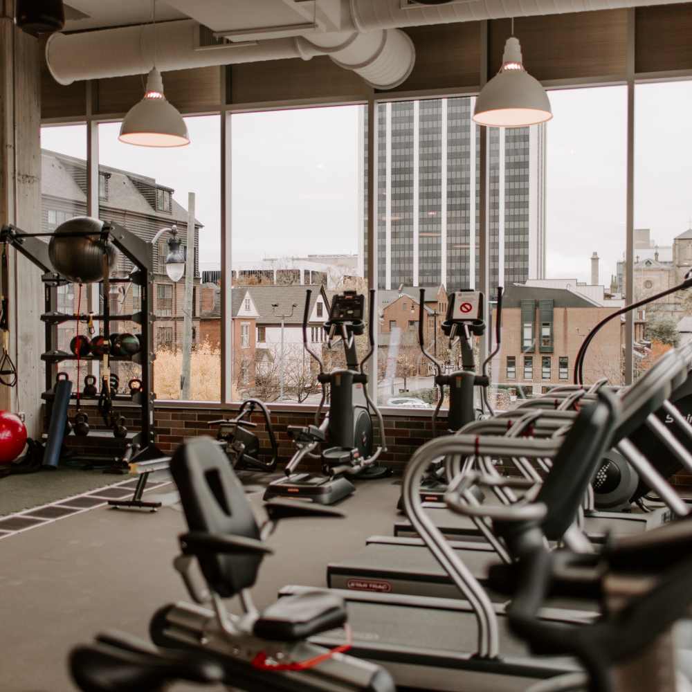 Fitness center overlooking the city at Industry Columbus Apartments in Columbus, Ohio