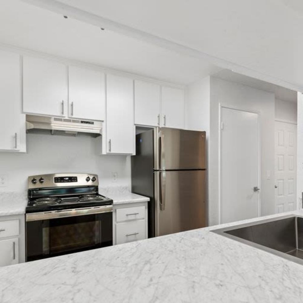 Kitchen with stainless-steel appliances at Mar at Mesa in San Diego, California