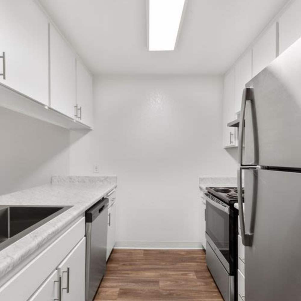 Kitchen with a dishwasher at Mar at Mesa in San Diego, California