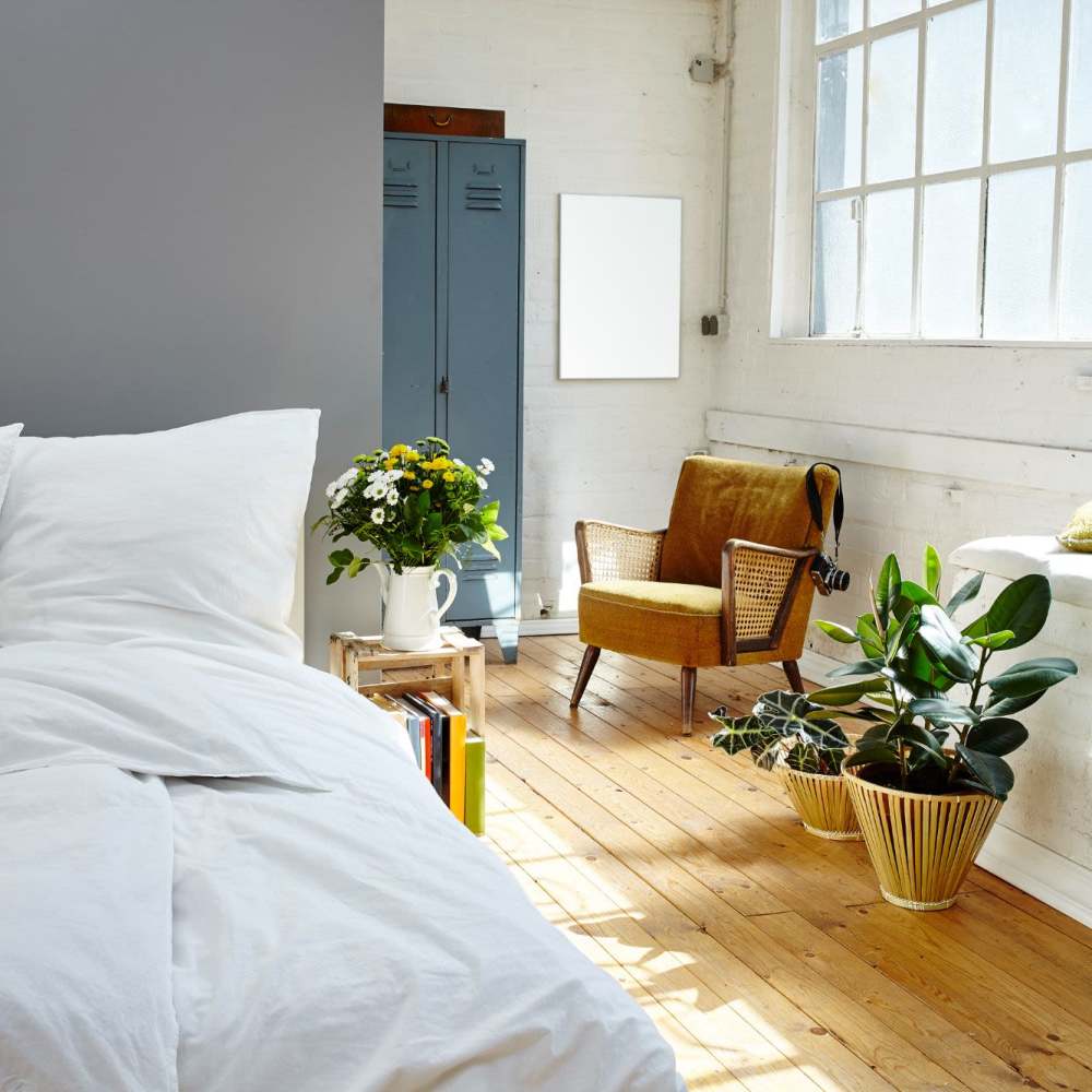 Modern-style bed and nightstand at Nexus 485 in Charlotte, North Carolina