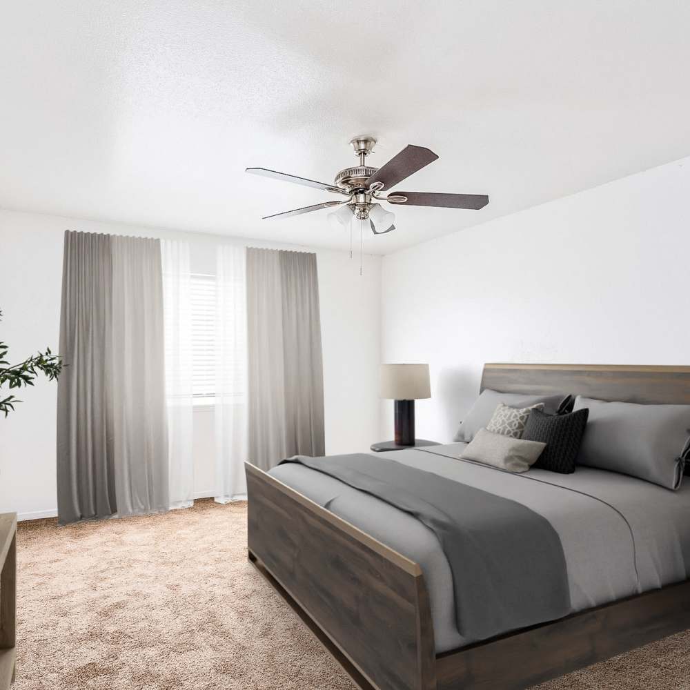 Bedroom with large windows at Las Rocas in Houston, Texas
