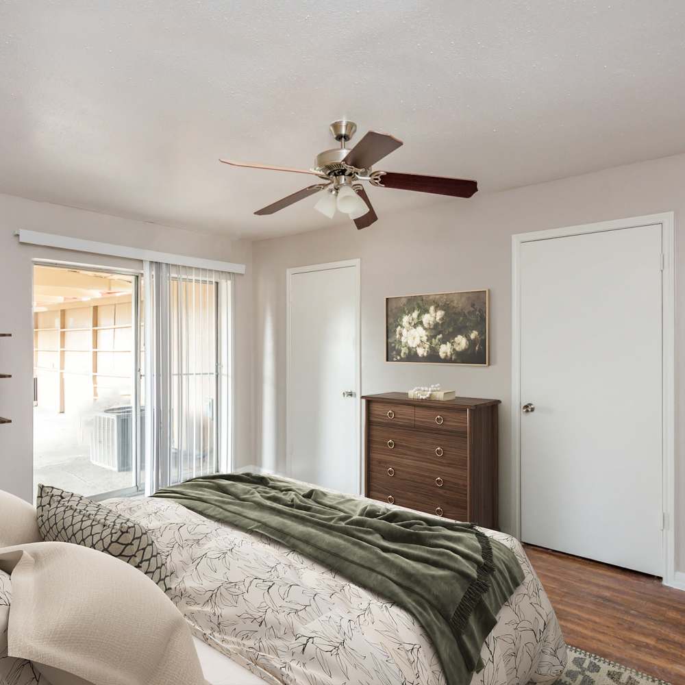 An open living area featuring modern furniture and faux wood flooring at Parkgreen On Gessner in Houston, Texas