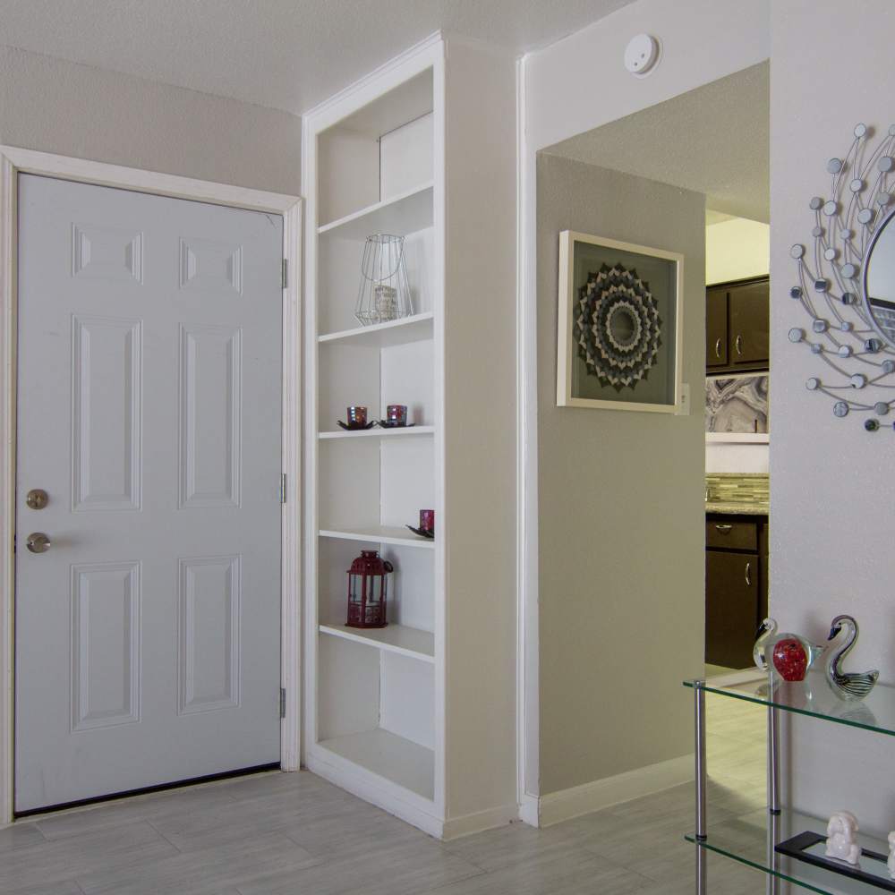 Several storage shelves in the living room at Villa Barcelona in Houston, Texas