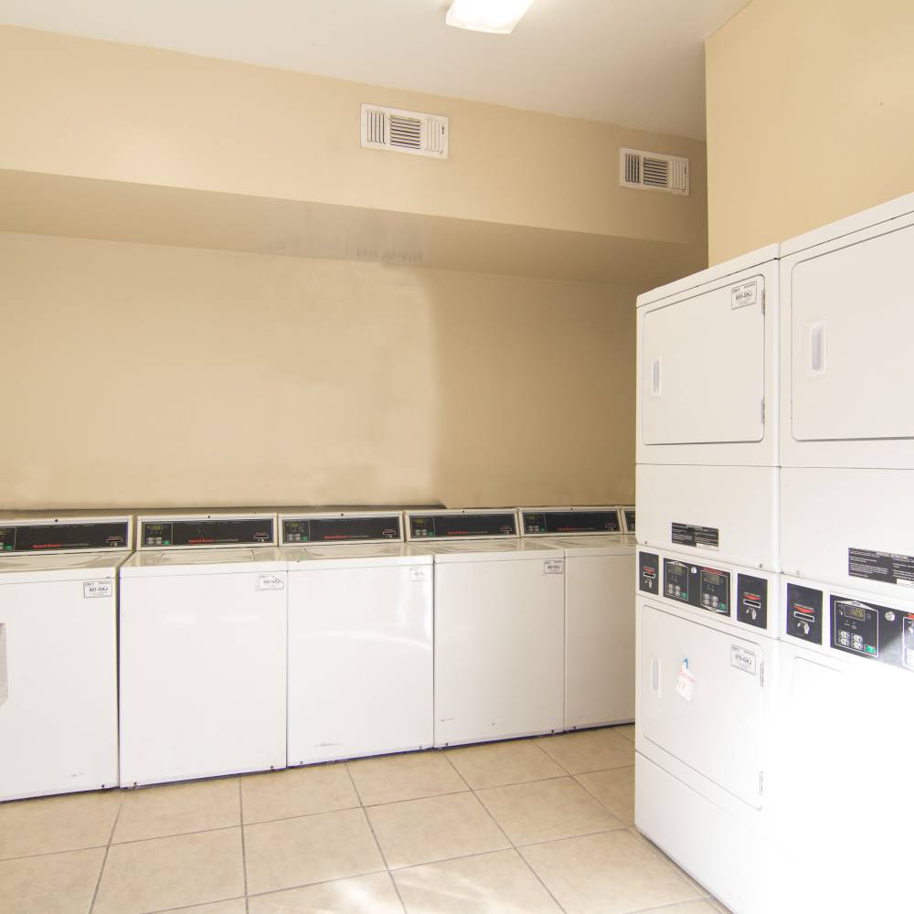  Laundry room with several washing machines at Villa Barcelona in Houston, Texas