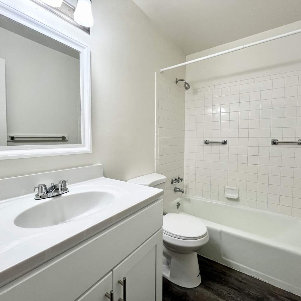 Bathroom with white cabinets at Collinwood Apartments in Newport News, Virginia