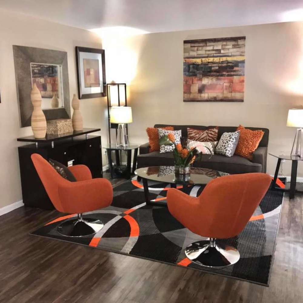 Living space with large windows at Palms At Chimney Rock in Houston, Texas