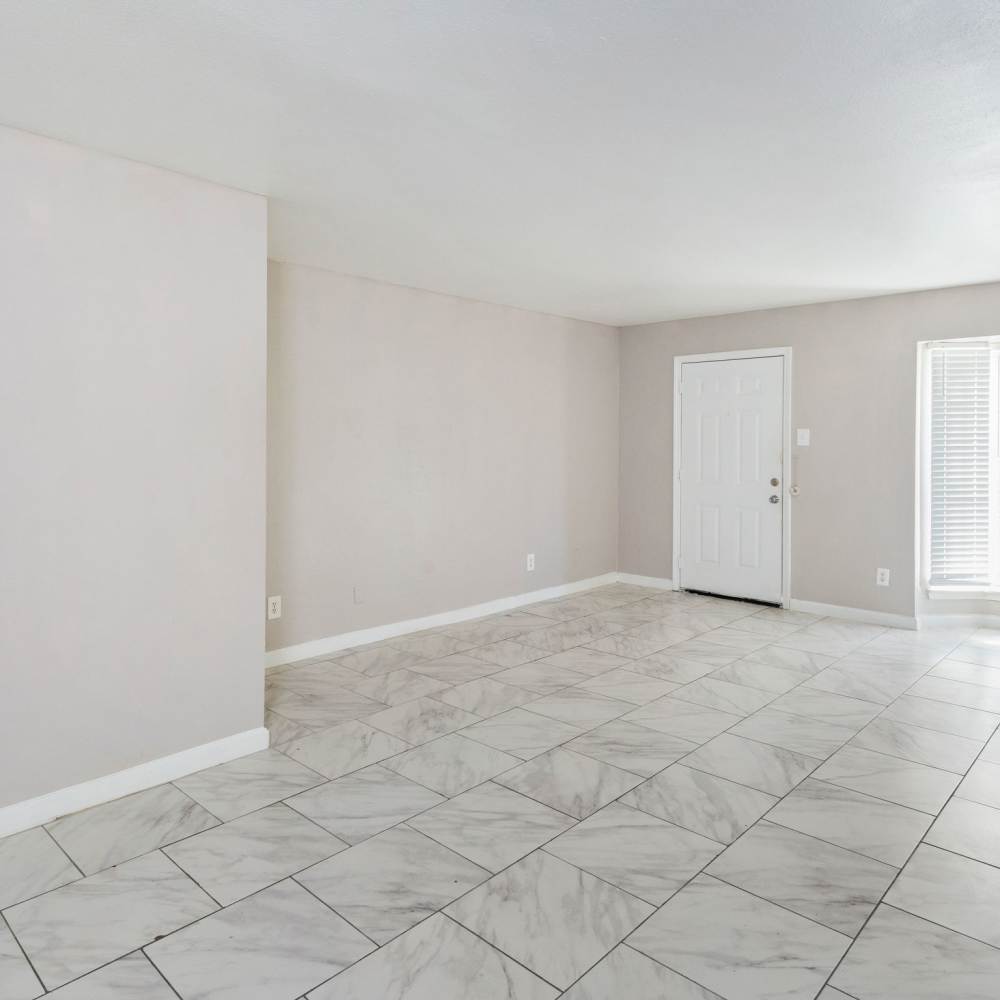 Living space with tile flooring at La Carmona in Houston, Texas