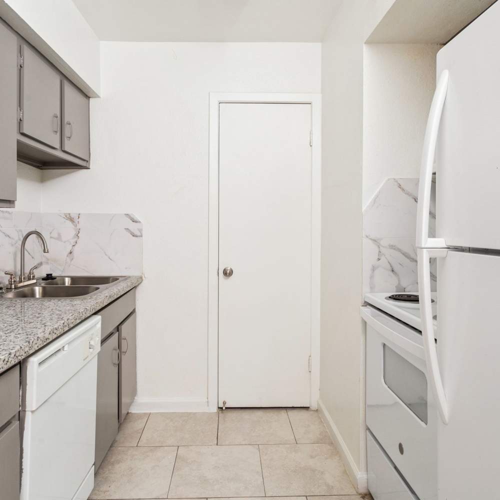 Kitchen with tile flooring at La Carmona in Houston, Texas