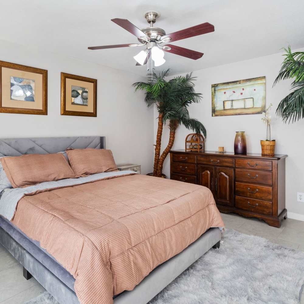 Bedroom with plush carpeting at La Carmona in Houston, Texas