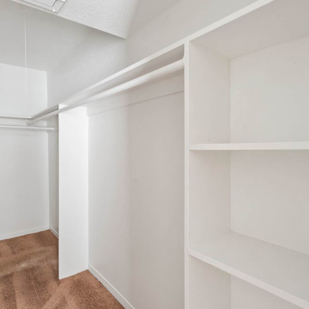 Closets with built in shelving at La Carmona in Houston, Texas