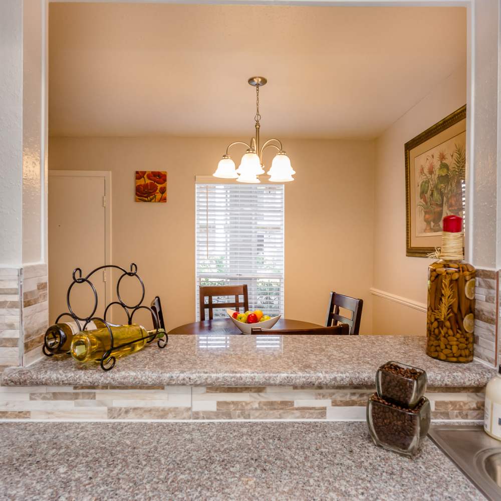 Kitchen with serving window at La Carmona in Houston, Texas