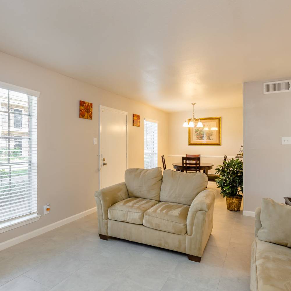 Living space with large windows at La Carmona in Houston, Texas